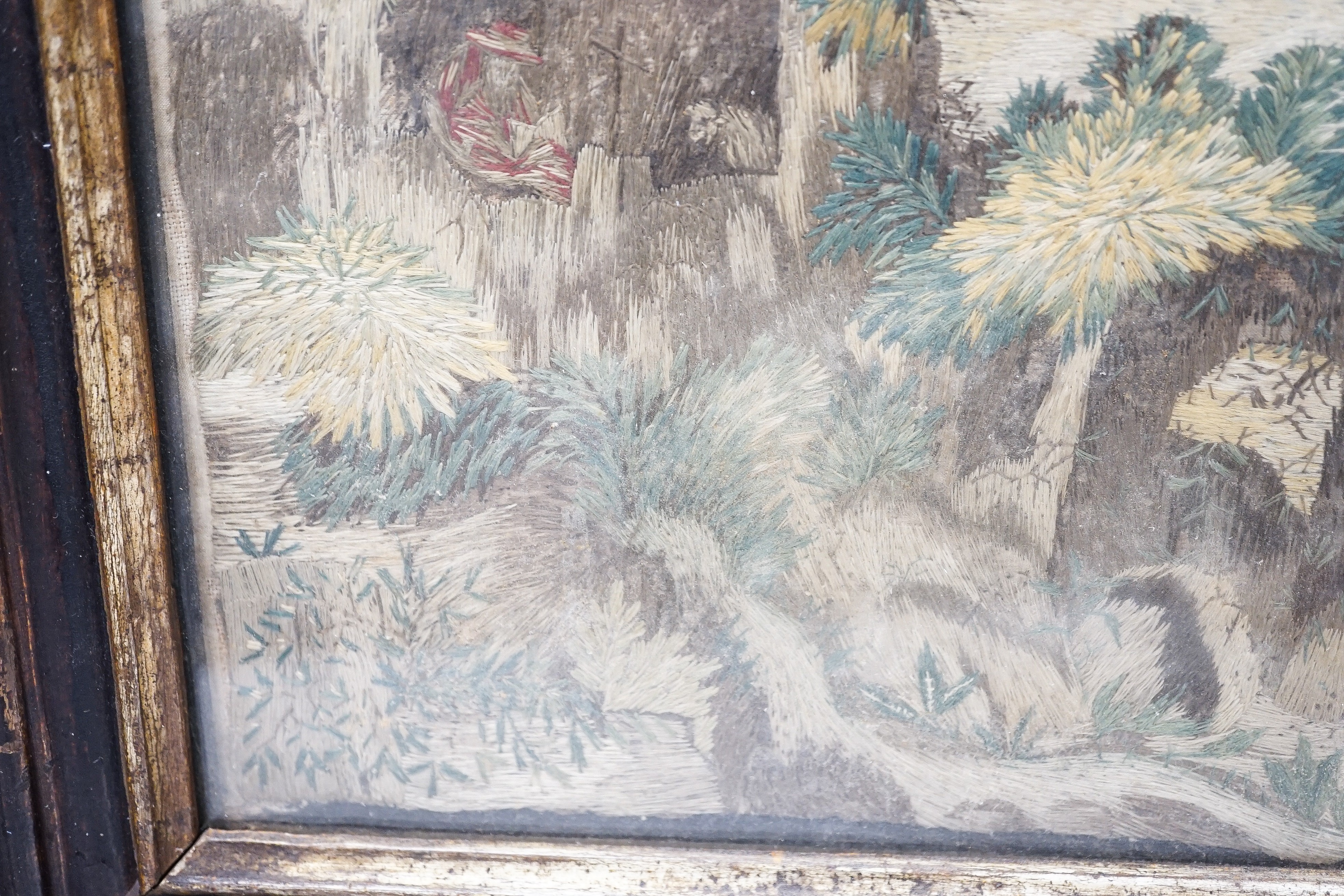 A pair of 18th century wool and silkwork pictures in ebonised frames, 26 cms high x 22 cms wide.